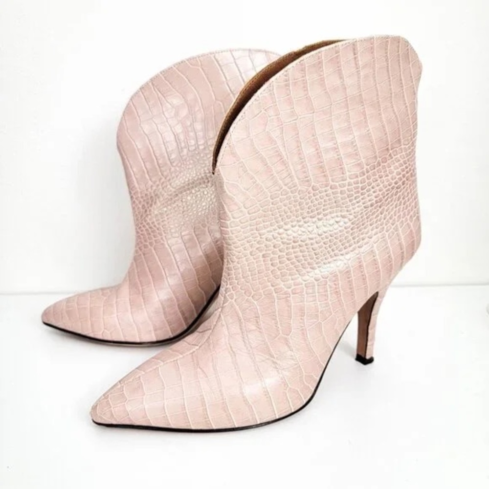Paris Texas pink high heeled boots.